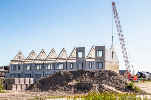 Construction of new homes in a new residential area. Construction of new homes in a new residential area. new building construction stock pictures, royalty-free photos & images