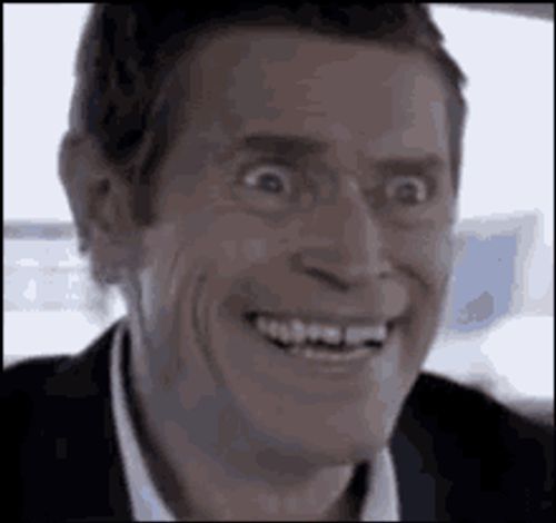 a close up of a man making a funny face while smiling .