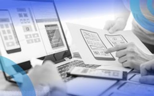 Two UX designers reviewing design icons for an app