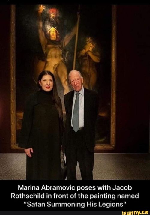 Marina Abramovic poses with Jacob Rothschild in front of the painting named "Satan Summoning His Legions"