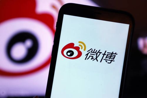 Mobile phone displays the "bomb comment" function of Sina Weibo in Shenzhen, South China's Guangdong Province, Oct. 28, 2021. After the user clicks...