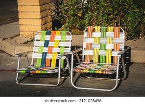Two empty vintage lawn chairs  Stock Photo