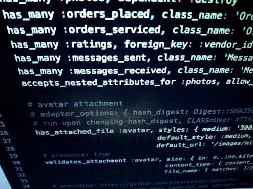 Free Close-up image featuring detailed programming code on a computer screen, ideal for tech-related themes. Stock Photo