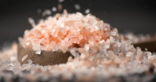 Himalayan pink salt. Due mainly to marketing costs, pink Himalayan salt is up to twenty times more expensive than table or sea salt. Himalayan pink salt. Due mainly to marketing costs, pink Himalayan salt is up to twenty times more expensive than table or sea salt. himalayan pink salt stock pictures, royalty-free photos & images