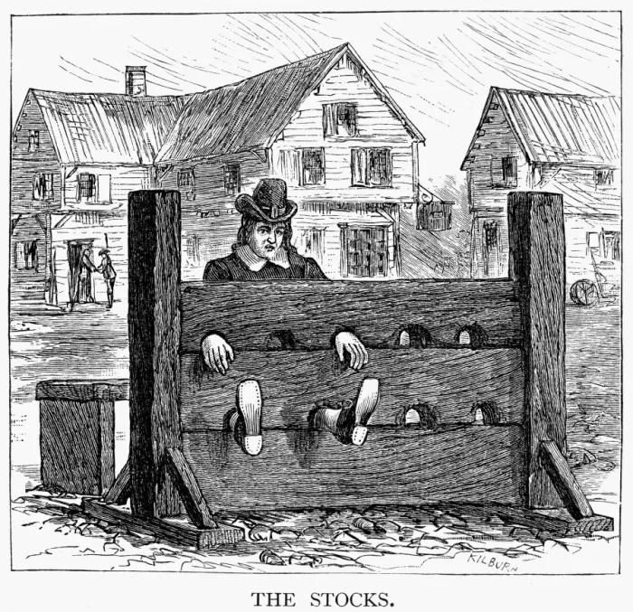 : COLONIAL STOCKS. A criminal in the stocks for punishment in colonial America. Wood engraving