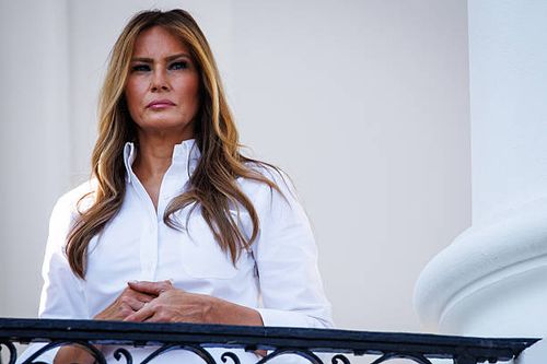 First lady Melania Trump listens as U.S. President Donald Trump delivers remarks during an Independence Day military family picnic on the South Lawn...