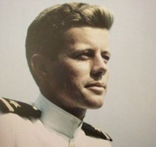 a man in uniform looks off into the distance