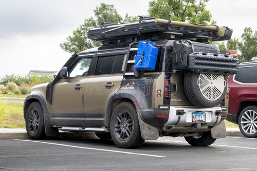 Loveland, CO, USA - August 24, 2025: Land Rover Defender P400 SUV with roof racks, roof tent, fuel and water tanks, recovery ladders - setup for offroading and overlanding. Land picture stock images, royalty-free photos and pictures