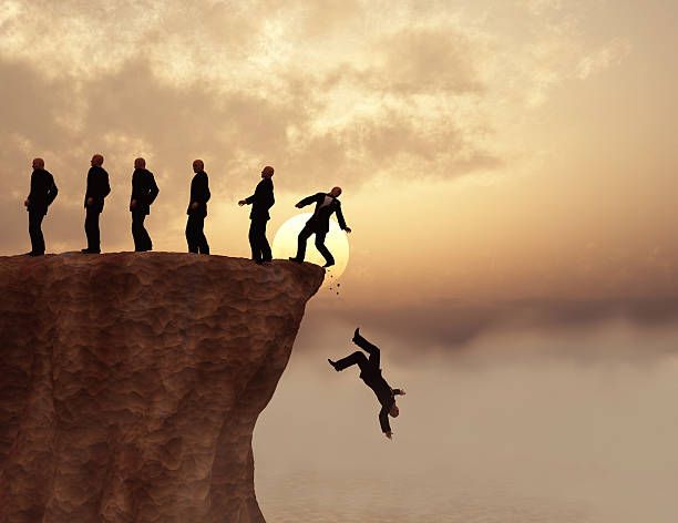 Men on a cliff Men on a cliff falling off a cliff stock pictures, royalty-free photos & images