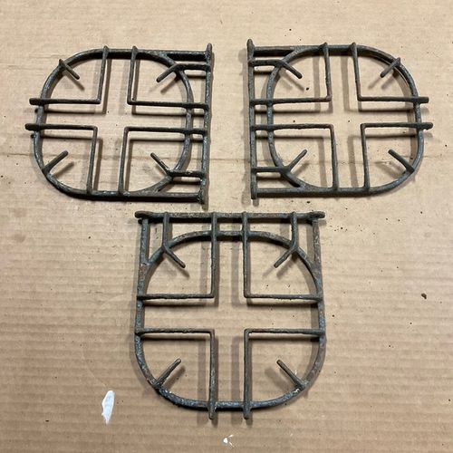 Three cast iron stove burners