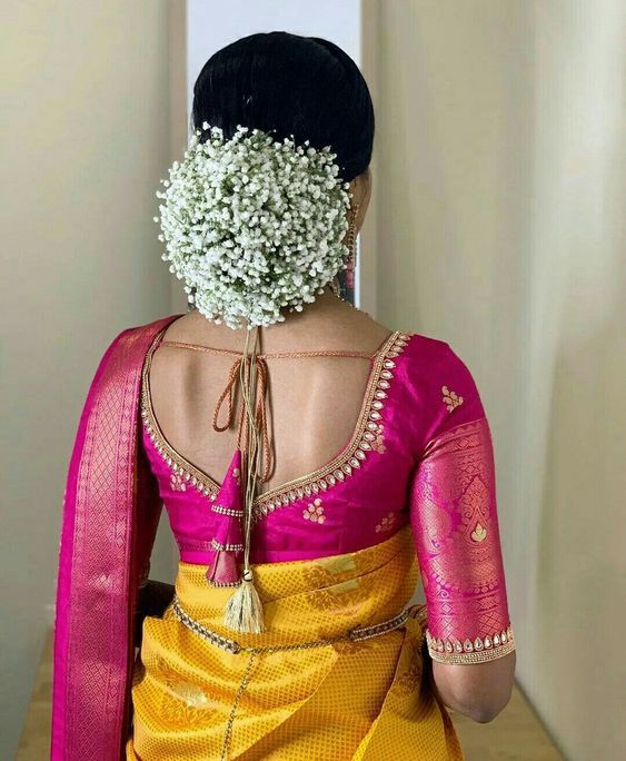 A client during a final fitting session in the atelier