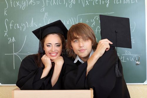 Educational theme: graduating students in academic gown in a classroom. Bachelors degree stock images, royalty-free photos and pictures