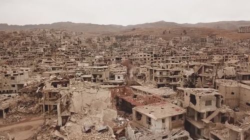 city of Aleppo, Syria, drone flight among the destroyed houses