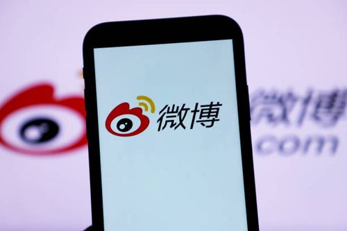 Mobile phone displays the "bomb comment" function of Sina Weibo in Shenzhen, South China's Guangdong Province, Oct. 28, 2021. After the user clicks...