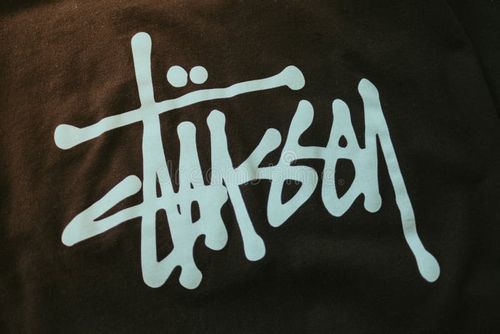 Stussy logo on T shirt. Stussy is a hype street wear brand. Stussy logo stock images, royalty-free photos and pictures