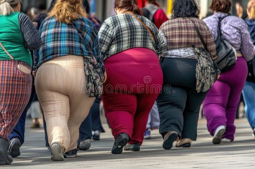 Group of overweight people walking in city. High quality photo. Obese people stock images, royalty-free photos and pictures