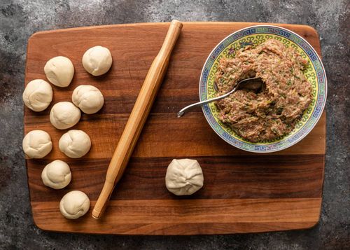 Vibrant Yiwu street stall with steaming pancakes