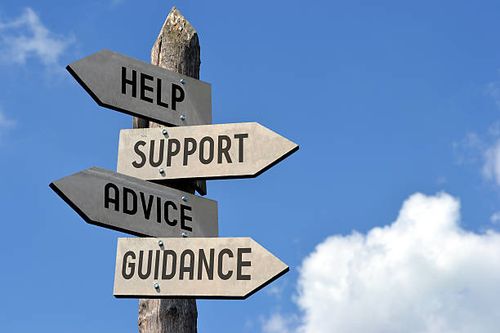 Help, support, advice, guidance signpost Wooden singpost with "help, support, advice, guidance" arrows against blue sky. support stock pictures, royalty-free photos & images