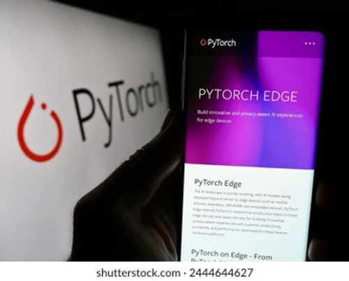 Stuttgart, Germany - 03-12-2024: Person holding smartphone with webpage of machine learning library PyTorch in front of logo. Focus on center of phone display. Unmodified photo. Editorial Stock Photo
