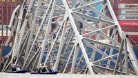 Baltimore bridge collapse: Vehicle removed from water, another hanging from metal