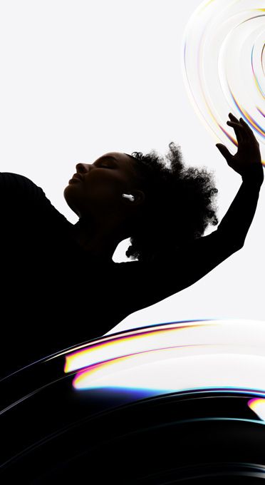 AirPods Pro 3 inserted in the ear of a dancer as they enjoy a hands-free listening experience