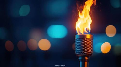 Burning torch, city night, bokeh background, event photo