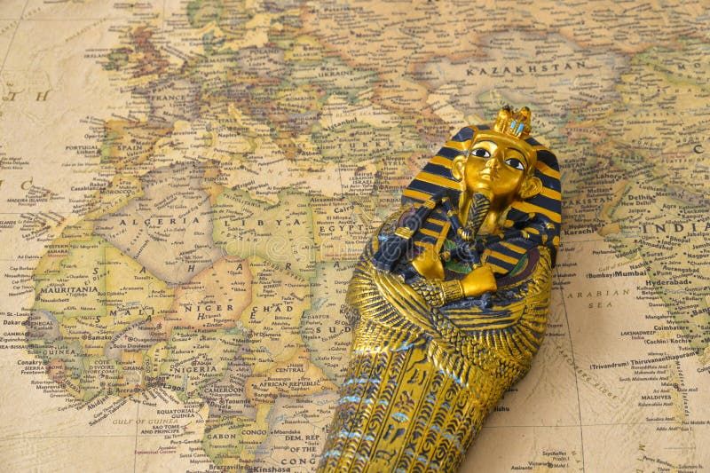 Egypt tourism concept - pharaoh Tutankhamun's sarcophagus on map. Egypt tourism concept - pharaoh Tutankhamun's sarcophagus on map