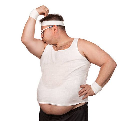 Funny athlete Funny overweight sport nerd kissing his bicep isolated on white background muscular fat man stock pictures, royalty-free photos & images
