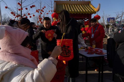 Crowds enjoying lantern displays at a festival night market