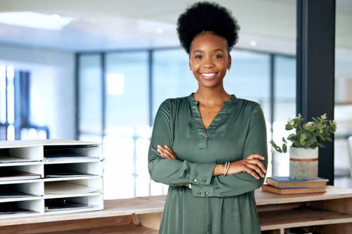 Shot of a young businesswoman standing in an office at work Always taking care of my business professional woman headshot stock pictures, royalty-free photos & images