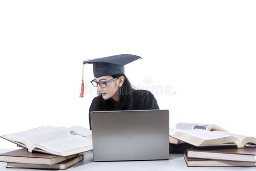 Young female graduate studying with laptop and books. Bachelor degree stock images, royalty-free photos and pictures