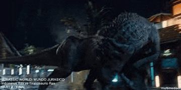 a couple of dinosaurs are standing next to each other in front of a building .