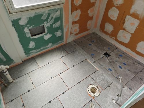 r/Tile - 12x24 tile in the shower is tough! First time laying out, any tips?