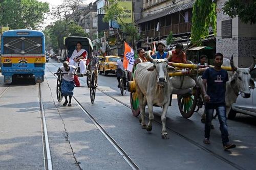 Supporters of Indias Congress party on a bullock cart take part in a protest rally against the rise in prices of petroleum products and essential...