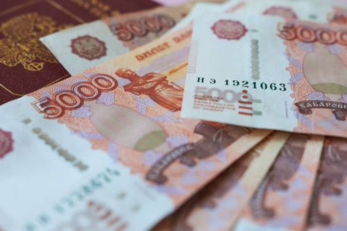 Russian banknotes on the background of a passport. 5000 rubles close-up. Russian banknotes on the background of a passport. 5000 rubles close-up. stack of russia ruble note stock pictures, royalty-free photos & images