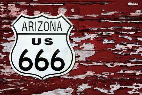 Close-up on an Arizona US 666 route sign screwed on a wooden wall painted in red. 666 stock images, royalty-free photos and pictures