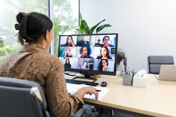 Young adult entrepreneur meets with investor team The young adult entrepreneur meets with an investor team to review her proposal. online course stock pictures, royalty-free photos & images