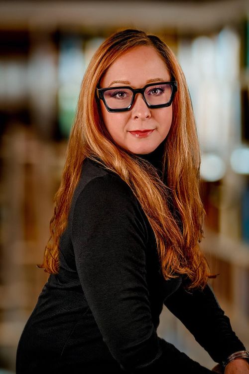 professional headshot woman in glasses