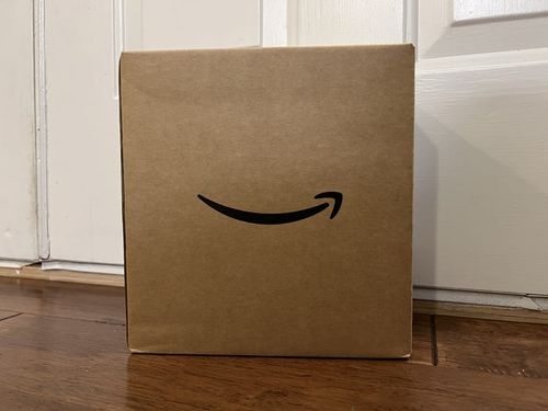 An Amazon box at a door