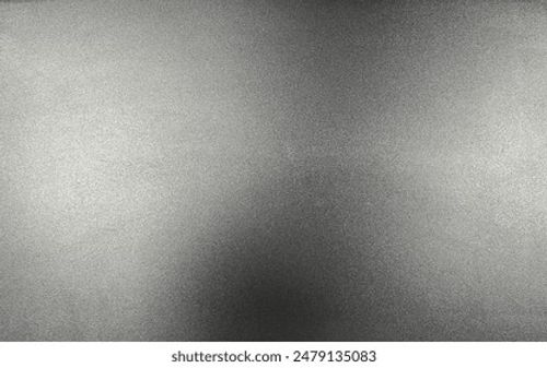 Dark gray silver texture background with a brushed metal effect, featuring a rough, grungy grain texture. It resembles stainless steel, perfect for a sleek, industrial look. Stock Photo