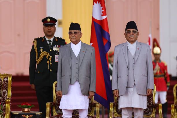 Nepal's newly appointed Prime Minister KP Sharma Oli and ousted Prime Minister Pushpa Kamal Dahal are attending the oath-taking ceremony of Oli in...