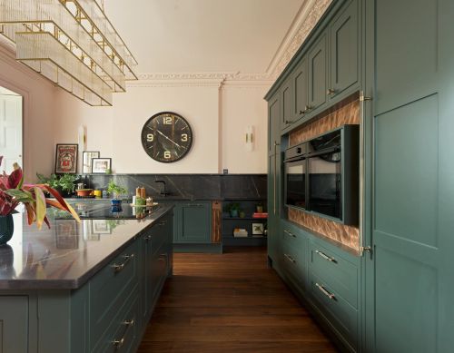 Rich green kitchen with appliance picture frame