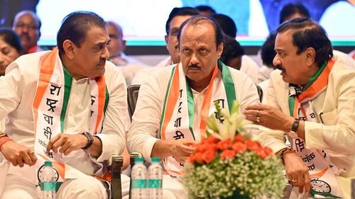Maharashtra Deputy Chief Minister Ajit Pawar interacts with his NCP party leaders at Shanmukhananda Hall in Mumbai. (File Photo)
