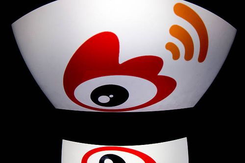 The chinese app Weibo's logo is displayed on a tablet on January 2, 2014 in Paris. AFP PHOTO / LIONEL BONAVENTURE