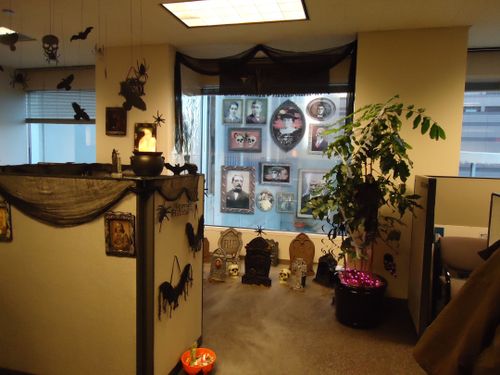an office decorated for halloween with decorations on the wall