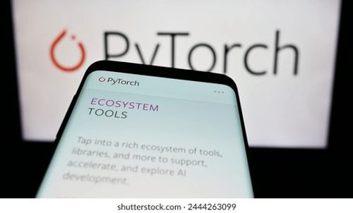 Stuttgart, Germany - 03-12-2024: Mobile phone with website of machine learning library PyTorch in front of logo. Focus on top-left of phone display. Unmodified photo. Editorial Stock Photo