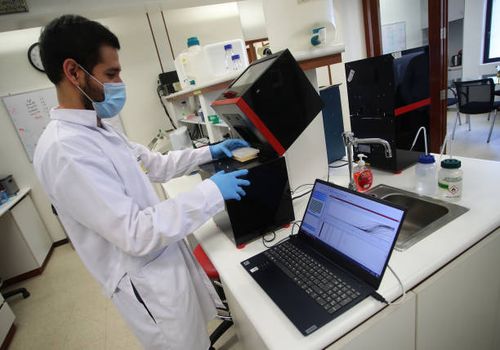 The biologist and bachelor of science Juan Blume works on the development of the rapid molecular test for COVID 19 on August 12, 2020 in Lima, Peru....