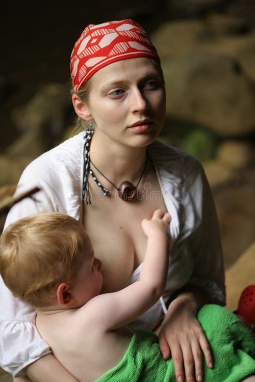 Mother breastfeeding small child outdoors. Breastfeed stock images, royalty-free photos and pictures