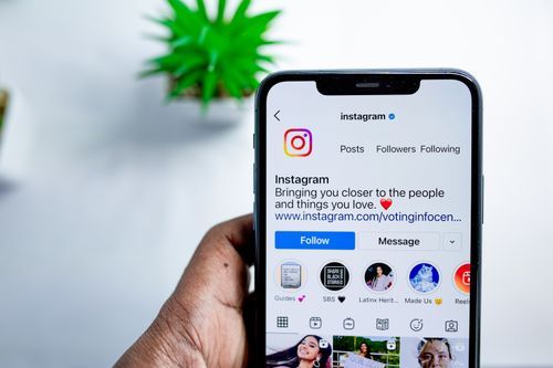 Free Close-up of a smartphone displaying the Instagram app, emphasizing social media connection. Stock Photo