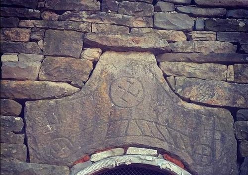 Swastika on the medieval tower arche in Khimoy, Chechnya
